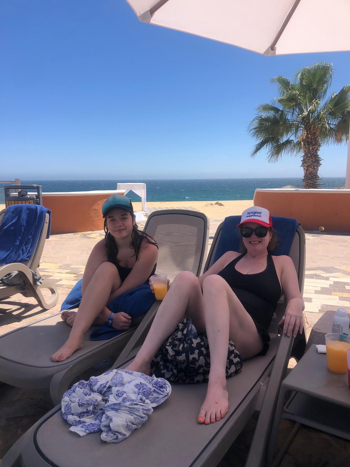 Lauryn and her daughter relaxing beside the pool at Sandos Finisterra